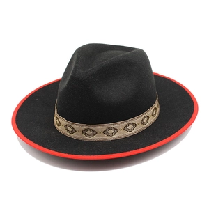 Detail of wool fedora hat with red edge contrast and geometric jacquard ribbon band