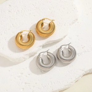 Textured hammered titanium steel hoop earrings in gold and silver finishes set