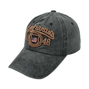 Detail of vintage San Francisco embroidery and US flag shield on washed grey baseball cap