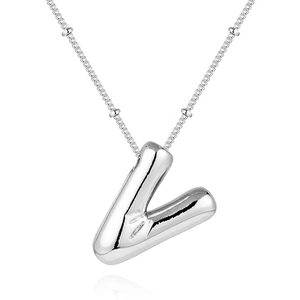 Detail of silver balloon letter V pendant on beaded chain with polished finish
