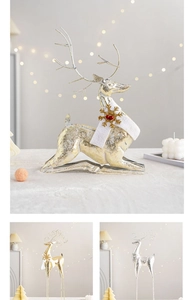 Detail of Christmas iron reindeer decor with gold glitter finish and white plush scarf