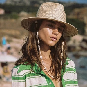 Vintage straw sun hat for women with shell chain strap and flat brim for beach travel