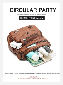 Détail du sac en cuir marron vintage montrant des compartiments pour une grande capacité