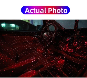Macro shot of red laser starlight projector casting dense red dots inside a car interior
