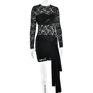 Close-up of black lace patchwork and ruched drawstring detail on long sleeve mini dress