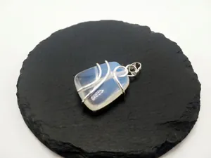 Handcrafted wire-wrapped natural opal gemstone pendant in a sleek silver-plated finish