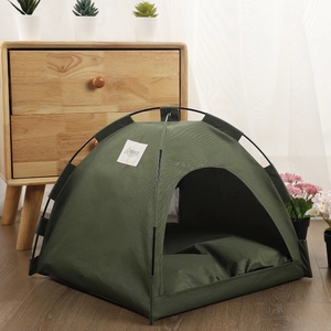 Army green portable pet tent for dogs and cats with cooling mat in a home setting