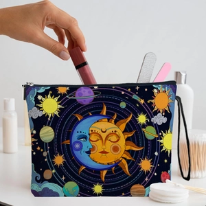 Celestial sun and moon pattern makeup bag with zipper closure shown in a lifestyle scene