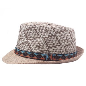 Detail of summer straw fedora hat featuring ethnic geometric pattern and woven texture