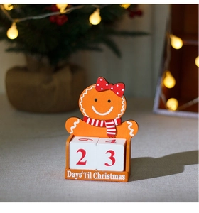 Detail of wooden gingerbread man advent calendar with cubes showing days until Christmas