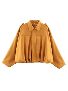Detail of ginger yellow faux suede jacket featuring notched lapels and soft velvet texture
