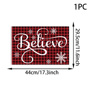 Detail view of Believe lettered Christmas placemat with red and black buffalo plaid pattern