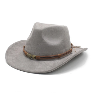 Detail of grey suede cowboy hat with braided brown band and vintage skull emblem