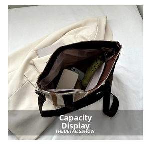 Spacious striped canvas tote bag showing interior storage with umbrella and notebook