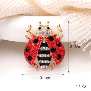Elegant crystal ladybug brooch with gold plating measuring 3.7cm by 3.1cm in size