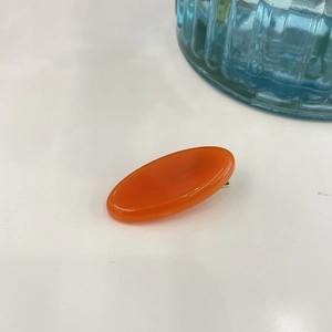 Orange oval handmade hair clip with rhinestones and France handmade gold lettering