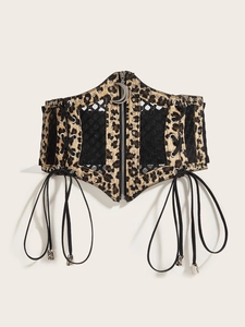 Detail of leopard print corset belt with silver crescent moon zipper and lace-up sides
