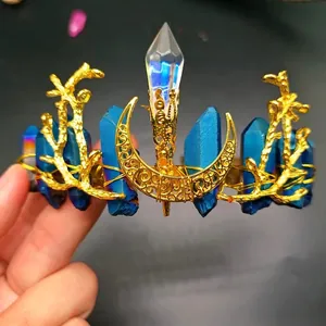Detail of handmade crystal crown with blue raw stones and golden moon elements