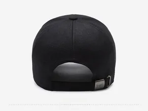 Detail of adjustable metal buckle with Sport engraving on black cotton baseball cap
