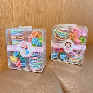 Colorful hair accessories set with elastic bands and flower clips in a storage box