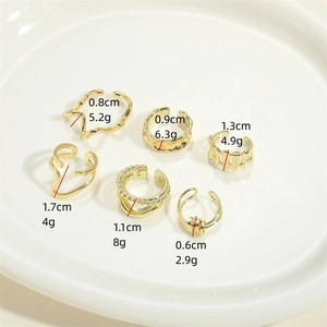 6-piece gold wave ear cuff set in various textures displayed on white ceramic