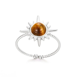Detailed close-up of bohemian silver sun ring featuring tiger eye stone and twisted rope band
