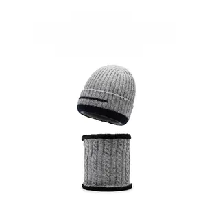 Detail of warm winter knit hat and neck warmer with thick fleece lining in light grey