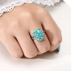 Detailed close-up of a vintage S925 sterling silver ring with oval turquoise and pavé accents