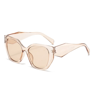 Oversized cat eye sunglasses in champagne tea color with transparent resin frames
