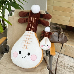Detailed view of plush pipa instrument toy with cute smile face and fluffy pompoms