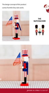 Macro detail of wooden nutcracker in patriot outfit holding a small American flag