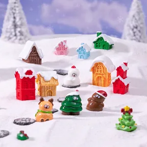 Miniature Christmas resin figurine set featuring snow-capped houses, reindeer and snowmen