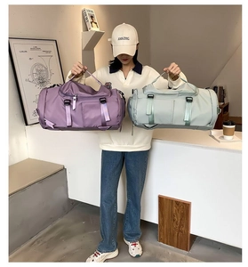 Detail view of large capacity waterproof travel bags in mint green and light purple