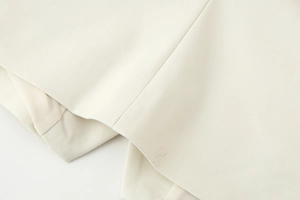 Close-up of the square neck vest showing twill weave fabric texture and stitching details