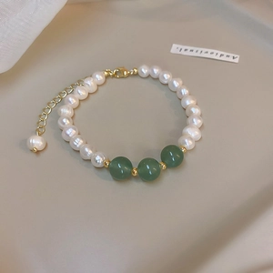Elegant vintage freshwater pearl bracelet with green beads and gold lobster clasp