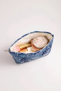 Top view showing the spacious interior and silver zipper of the blue paisley makeup bag