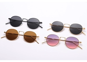 Detailed view of vintage round sunglasses in four metallic frames and colorful lenses