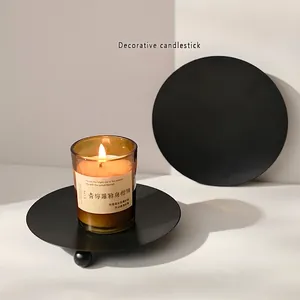 Nordic black matte metal candle holder tray with minimalist round design and ball feet
