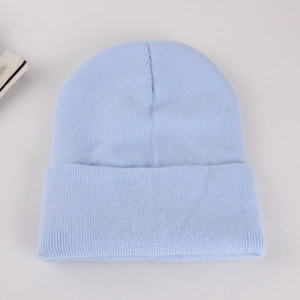 Unisex light blue knitted beanie hat with classic ribbed cuff for winter warmth