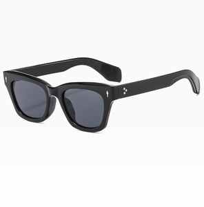 Detailed side view of stylish black square sunglasses with silver arrow metal rivets