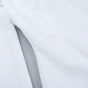 Close-up of white A-line dress featuring high-quality fabric texture and neat stitching details