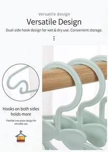 Detail of light green bow-shaped kids hanger with side hooks and non-slip design