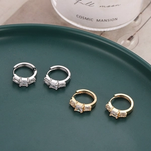 Elegant gold and silver geometric hoop earrings with sparkling cubic zirconia stones