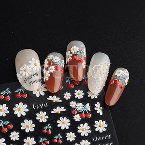 5D embossed nail art stickers with white daisy and red cherry designs for manicures