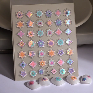 Macro detail of 5D holographic flower nail stickers with sparkling crystals and gradients