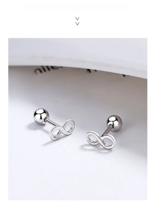 Macro view of infinity symbol silver stud earrings with screw-back design and polished finish