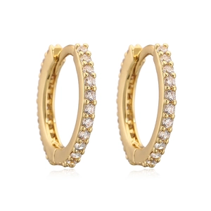 Macro detail of gold round hoop earrings with micro-paved cubic zirconia crystals