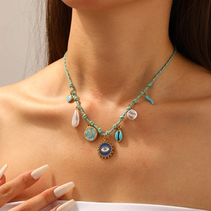 Bohemian blue rope necklace with evil eye, shell, moon, and pearl charms for women