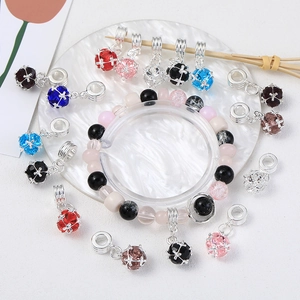 Sparkling crystal ball bead pendant for DIY jewelry making on white marble background