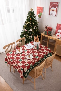 Close-up of waterproof polyester tablecloth with Christmas reindeer and plaid patterns